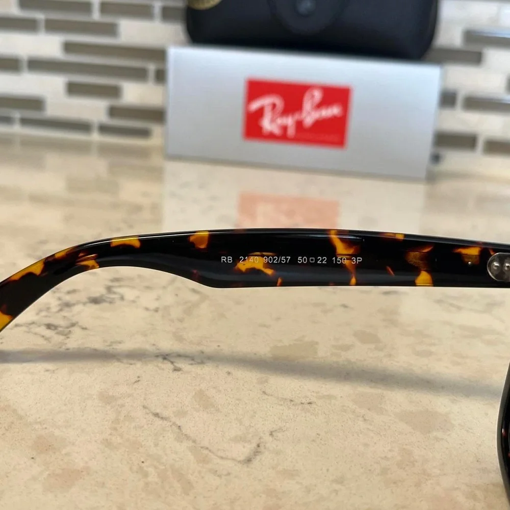 Ray-Ban Wayfarer Classic Black and Brown Polarized Sunglasses.